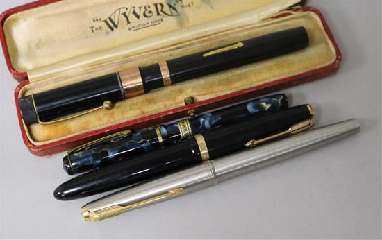 A Wyvern pen with gold mounts, a Burnham pen with label and two Parker pens